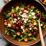 Warm Arugula Salad with Roasted Grapes and Goat Cheese