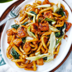 Spicy Stir‑Fried Udon Noodles with Tofu and Bok Choy