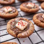 Peppermint Bark Chocolate Thumbprint Cookies with Melted Chocolate Centers and Festive Candy Topping 3 Peppermint Bark Chocolate Thumbprint Cookies with Melted Chocolate Centers and Festive Candy Topping