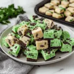 Mint Chocolate Chip Fudge Squares Layered with Cookie Dough and Brownie Crust 3 Mint Chocolate Chip Fudge Squares Layered with Cookie Dough and Brownie Crust
