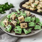 Mint Chocolate Chip Fudge Squares Layered with Cookie Dough and Brownie Crust